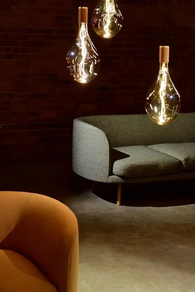 demand interior design | Three Edison Light Bulbs Beside the Sofa | Best Interior Designers in Hyderabad | F7 Interiors